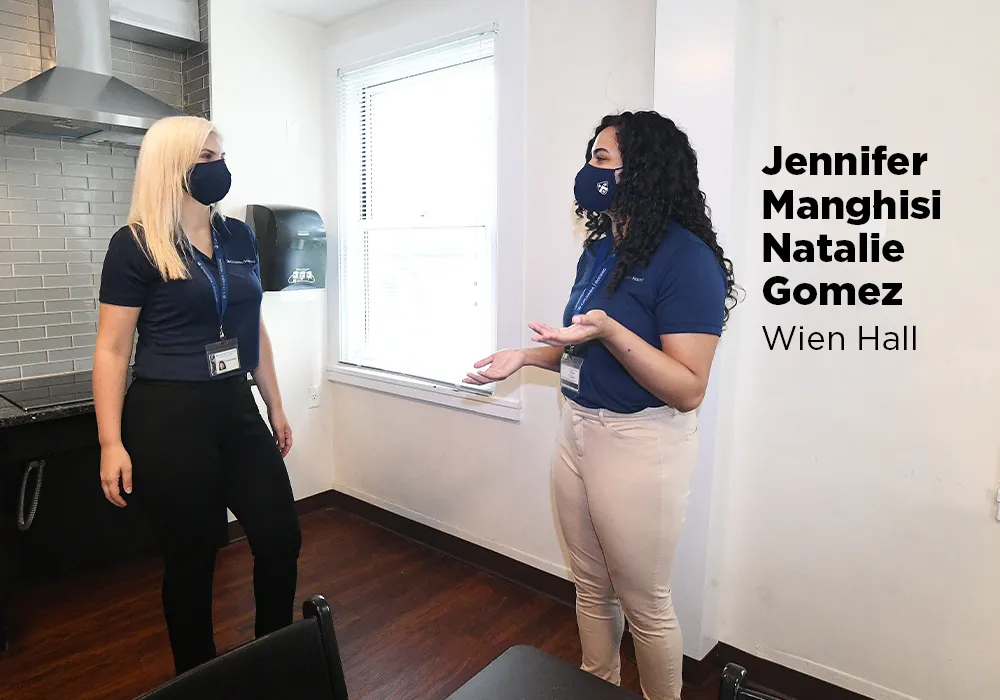 Jennifer Manghisi and Natalie Gomez review space in Wien Hall to discuss building plans, including room layouts, bathrooms, and shared space. The Columbia Housing team was responsible for determining a revised approach to room assignments based on public health directives to maintain low density in the residence halls and provide for a safe living environment for students. 