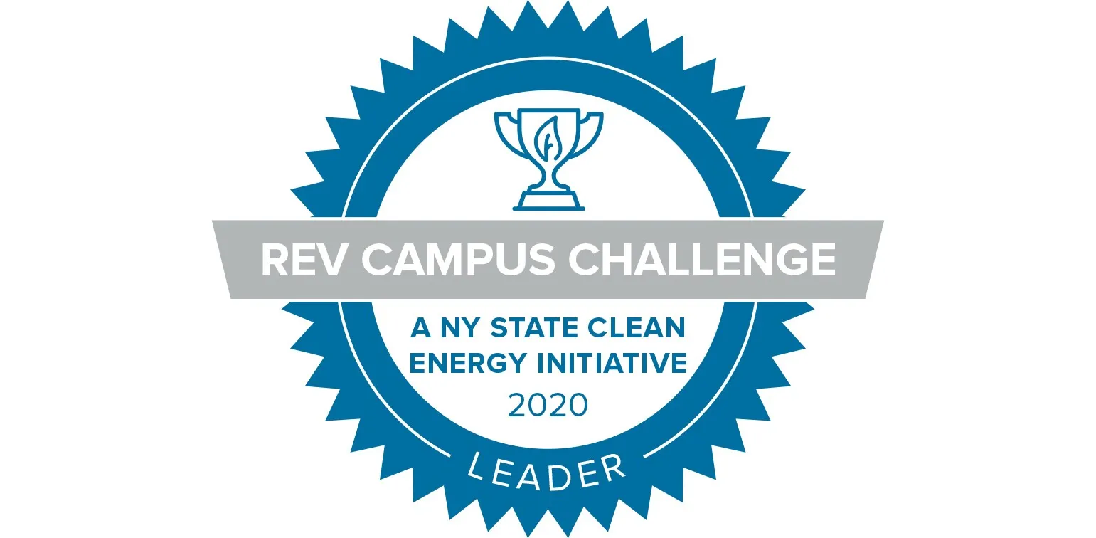 A blue seal that has a trophy inside that says REV Campus Challenge - A NY State Clean Energy Initiative 2020