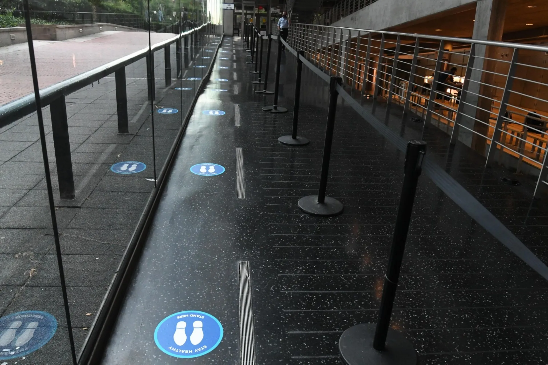 A pathway in Lerner Hall that has physical distancing stickers on the ground